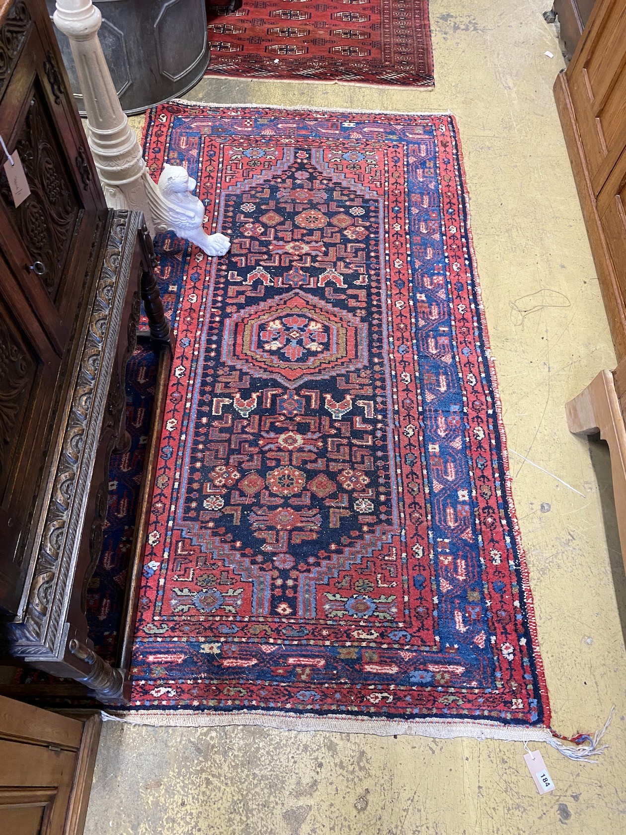A Caucasian blue ground rug, 200 x 110cm